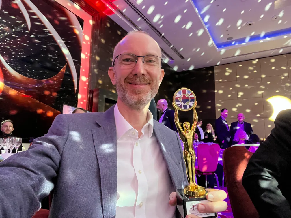 Matthew Gibson holding the Soldiering On Award